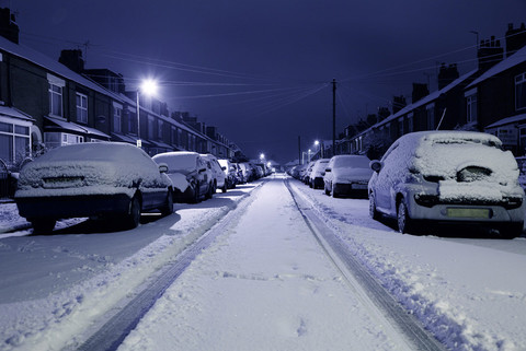 Cars covered in snow