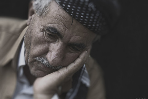 Elderly man looking upset