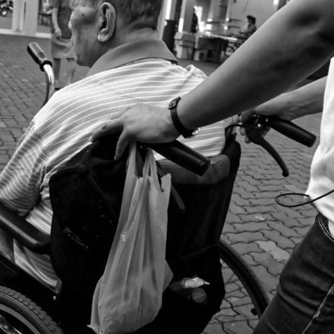 Elderly man in a wheelchair