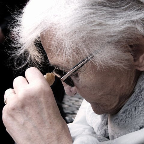 Elderly lady looking down