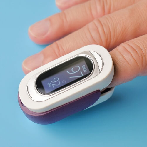 pulse oximeter on finger used for monitoring oxygen levels for adults