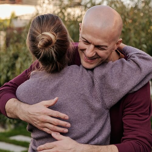 man and woman hugging on autism awareness day