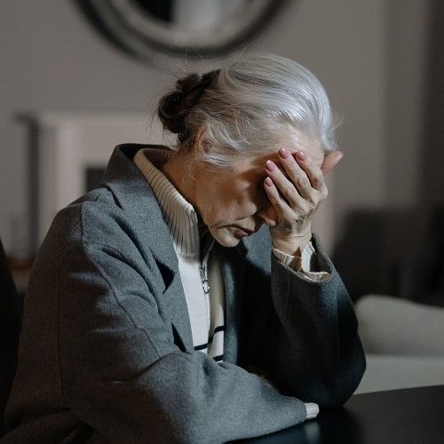 elderly woman living with common mental health conditions